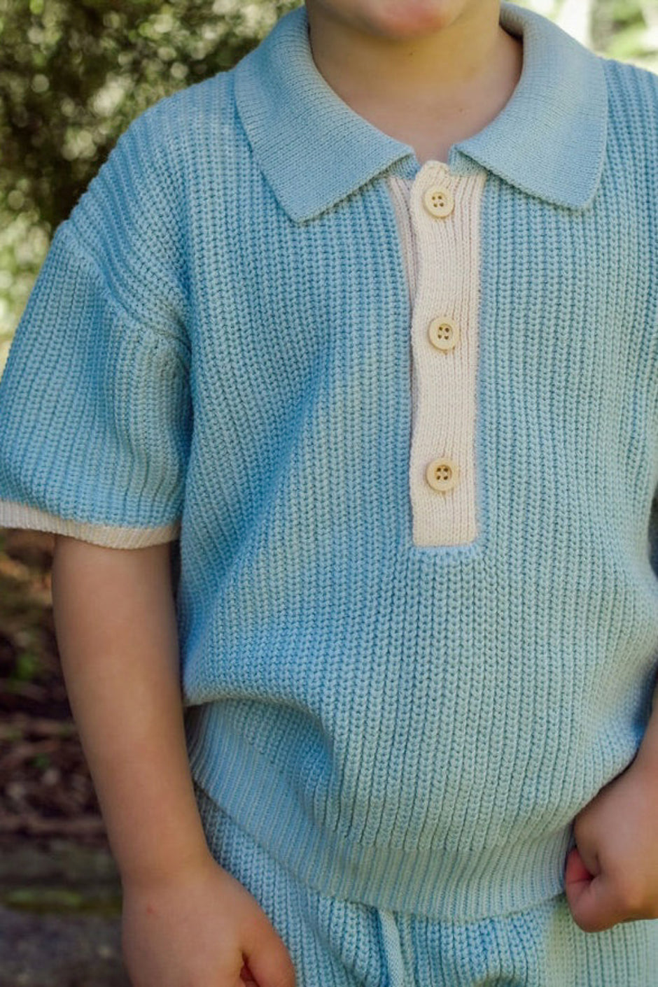 Toddler wearing the Willow Set in Heirloom Blue — boys' 100% organic cotton knit two-piece with oat detailing