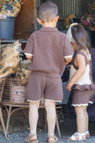 Toddler wearing the Willow Set in Chestnut — boys' 100% organic cotton knit two-piece with oat detailing