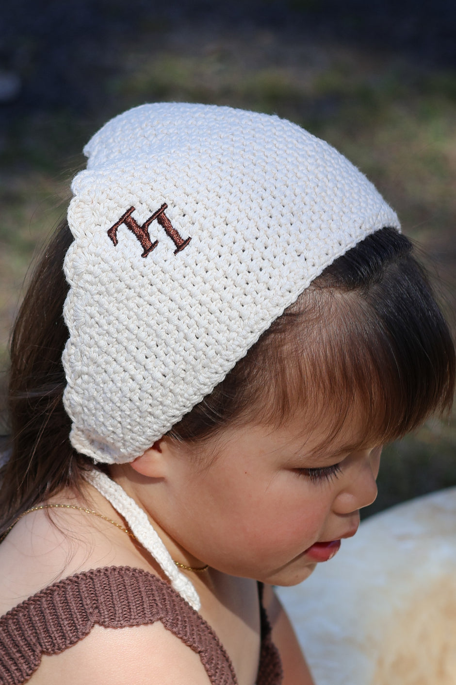 Toddler wearing the Bloom Bandana — 100% organic cotton bandana with embroidered LL initials
