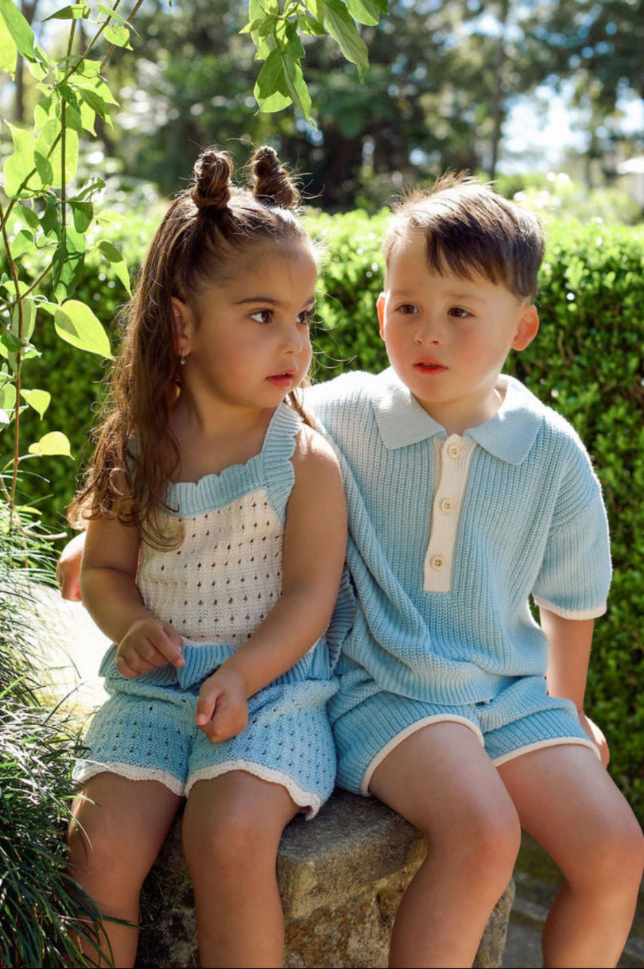 Toddler wearing the Willow Set in Heirloom Blue — boys' 100% organic cotton knit two-piece with oat detailing